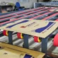 Corrugated boxes on a conveyor system, in EZI factory