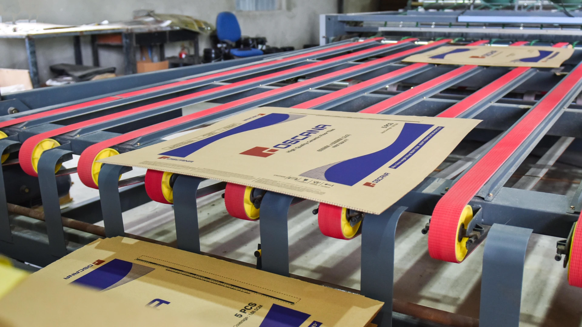 Machine printing on corrugated boxes at EZI factory.