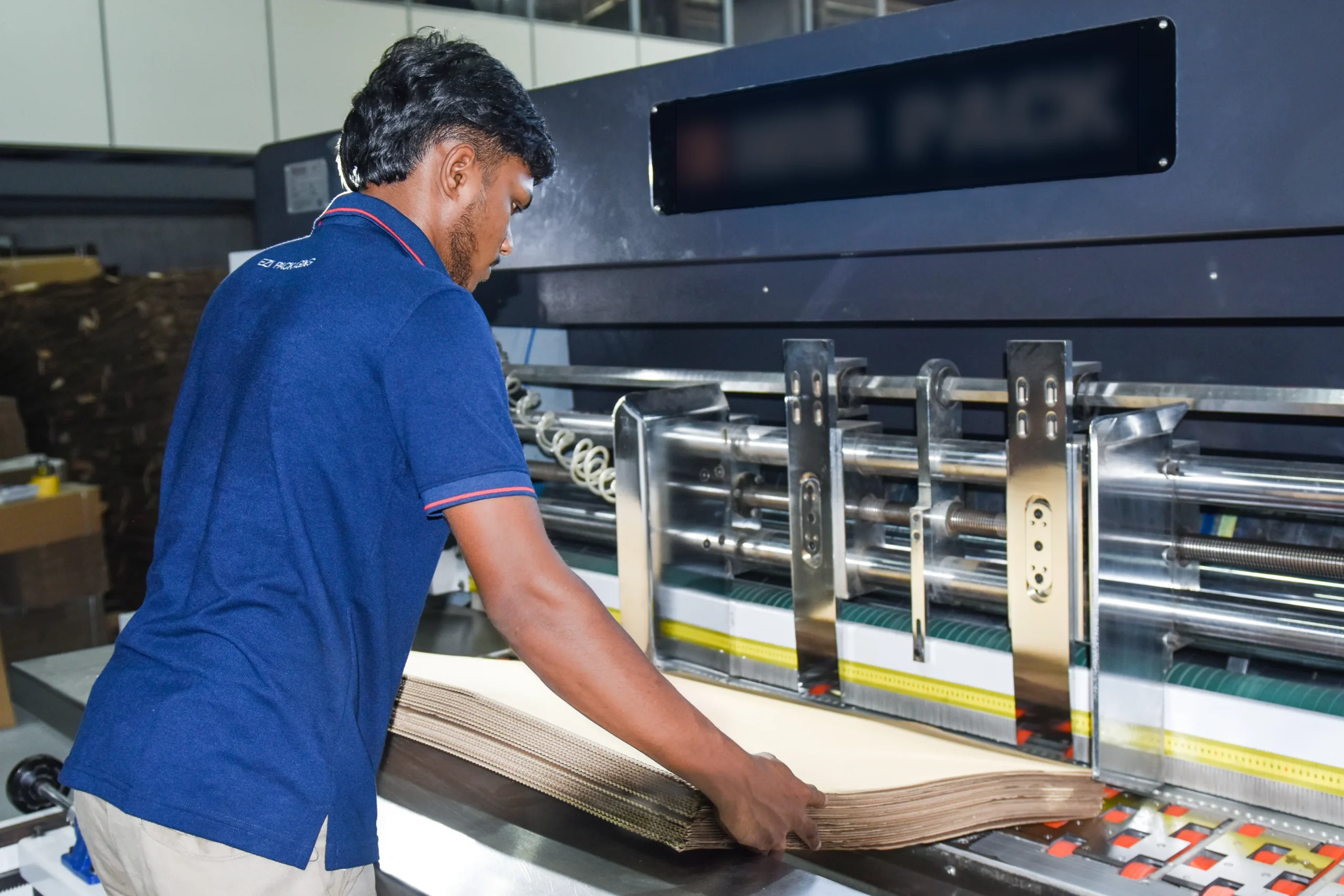 Team member working on the EZI packaging line